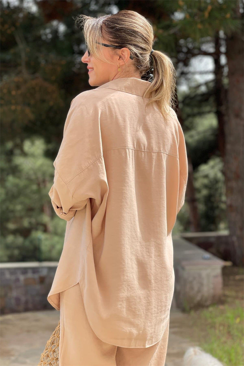 Back view of the tan shirt and wide-leg cropped trouser set showing the shoulder line and wide leg
