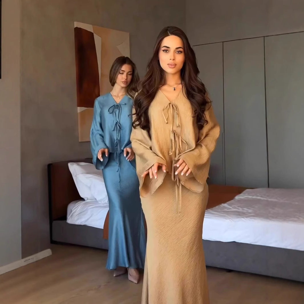 Khaki crinkle satin two-piece set close three-quarter view with the tie-front blouse and fitted maxi skirt
