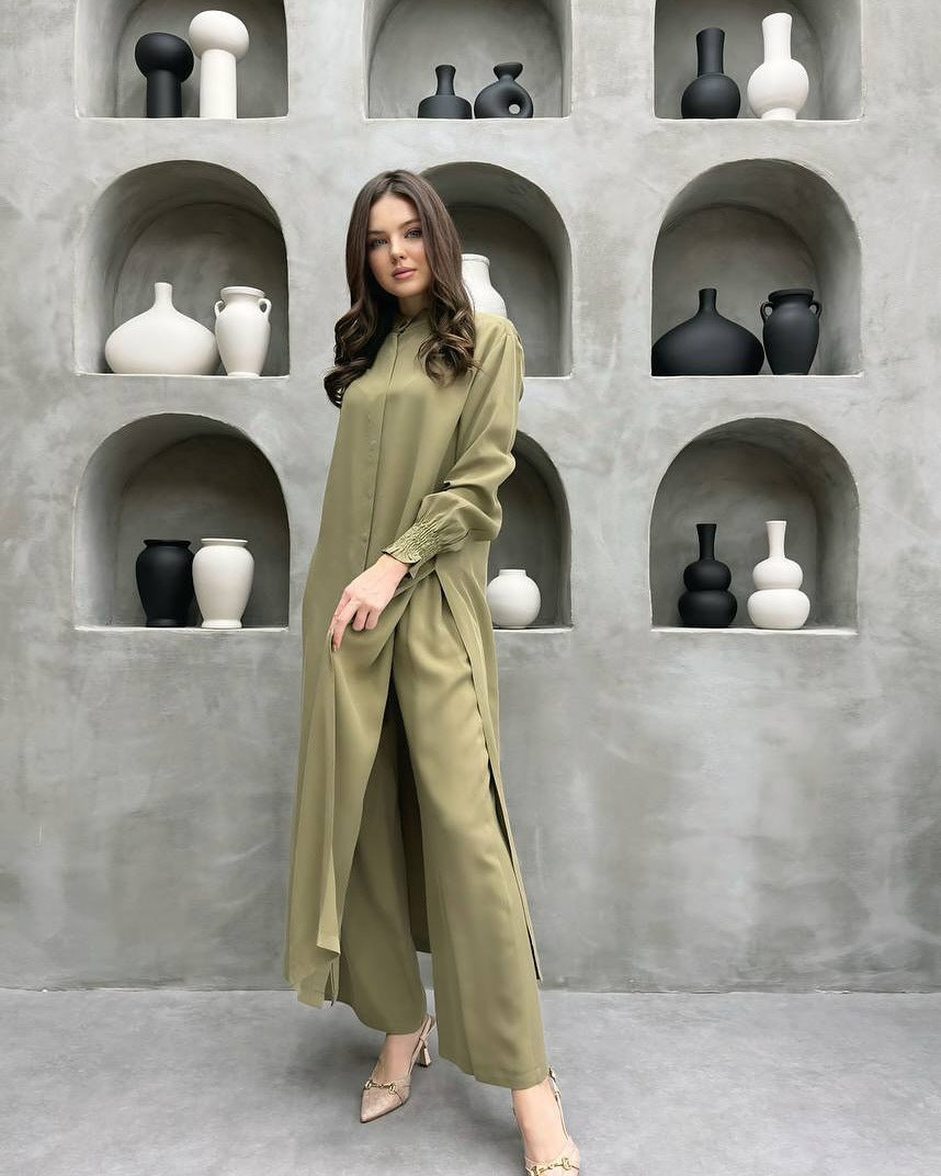Grass green long stand-collar shirt and straight-leg trouser two-piece set worn full length, with the self-tie sash knotted at the waist