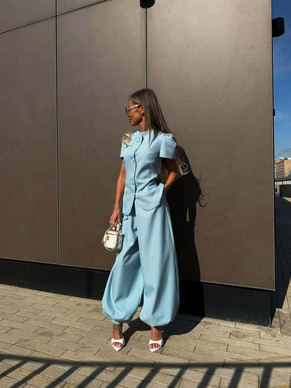 Powder blue jacket and wide-leg trouser set shown full length outdoors