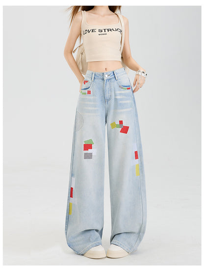 Geometric embroidered jeans